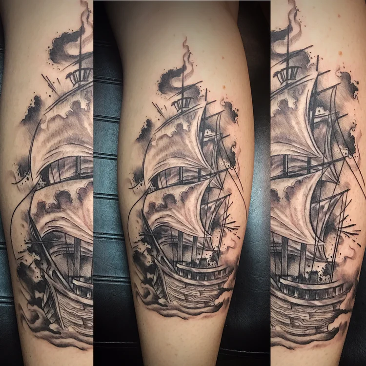 Black and grey sailing ship tattoo on the calf