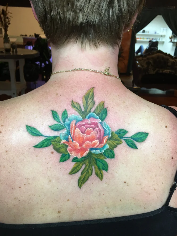 Color peony flower tattoo on the upper back
