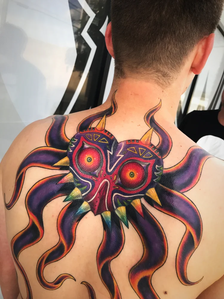 Color mask with tentacles on the upper back